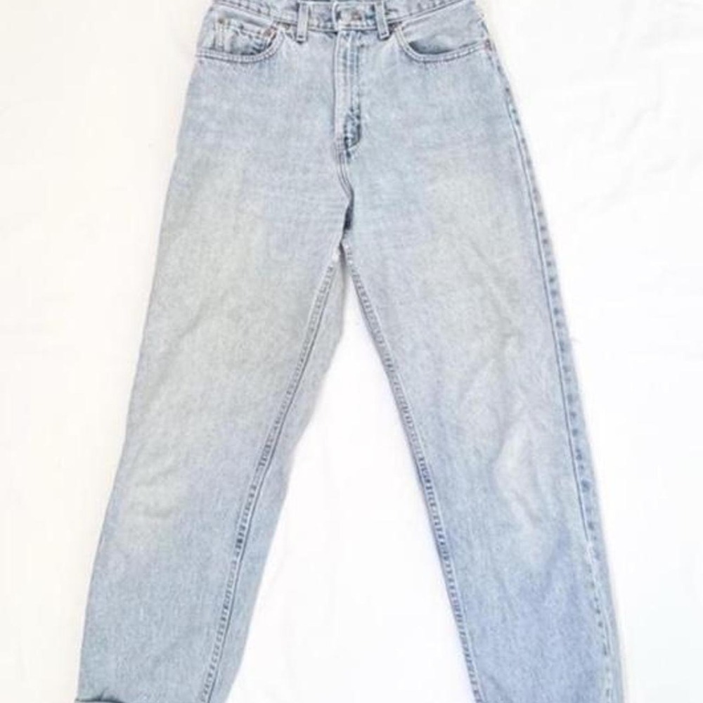 True vintage Levis 560 denim faded light wash jeans with a high waisted fit